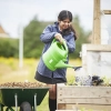 Student watering plants