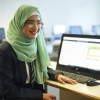 A student studying in a computer suite