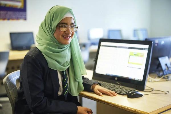 A student studying in a computer suite