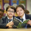 Students reading together in class