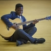A student playing the guitar