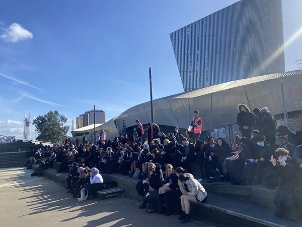 Students enjoying their lunch break in Salford Quays, March 2024